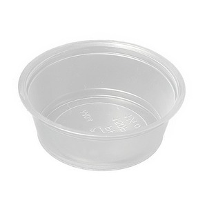 Clear plastic round container with a shallow depth and raised rim, viewed from above.