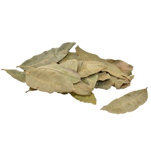 Pile of dried bay leaves on a white background