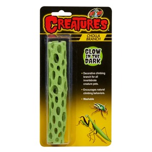 Green porous climbing branch toy in blister pack labeled Creatures Glow in the Dark.