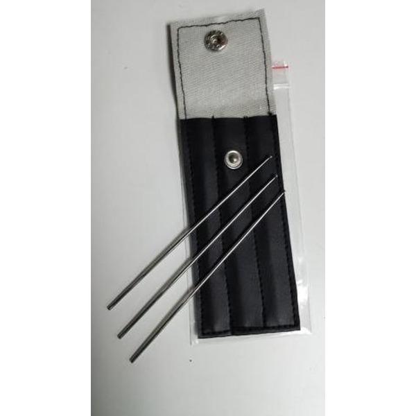 Gray fabric roll with a black padded pocket holding four long thin metal needles and a snap-button closure.