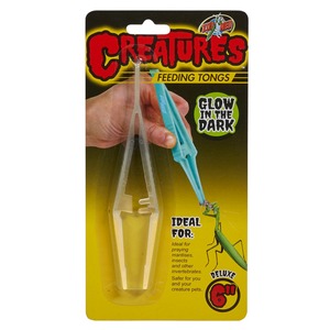 Packaging for Creatures feeding tongs; clear plastic tongs with a blue attachment, glow in the dark.