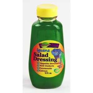 Green bottle with yellow cap labeled Iguana Salad Dressing by Nature Zone; label features an iguana illustration and benefits.