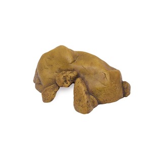 Brown clay sculpture of a bear lying on its side with legs tucked.