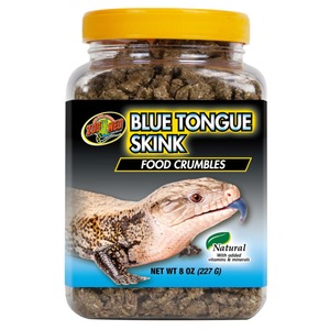 Jar with yellow lid containing Blue Tongue Skink food crumbles; label shows a skink.