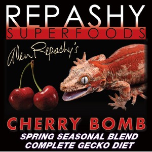 Repashy Superfoods Cherry Bomb gecko diet with two cherries and a lizard on a black background.