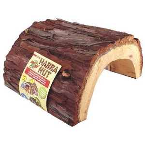 Log-shaped cake with a bark-like crust and a hollow interior, label attached.