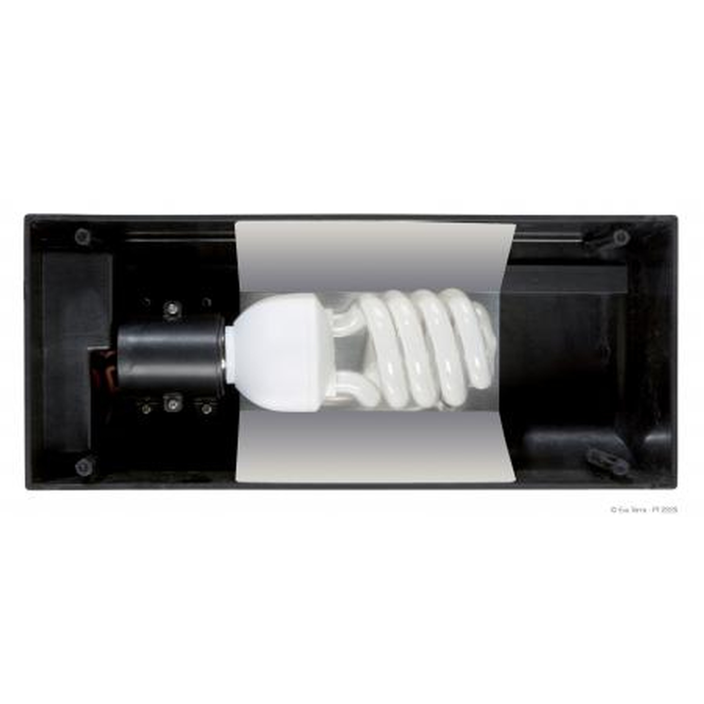 Compact fluorescent light bulb installed in a black rectangular fixture with a white paper strip across it.