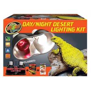 Orange Day/Night Desert Lighting Kit box with a yellow lizard on a rock, a shiny reflector lamp, and included accessories.