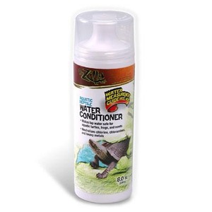 White bottle of turtle water conditioner with a label showing a turtle and a pond scene.