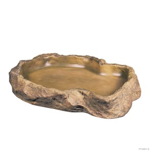 Irregular brown stone bowl with a smooth, shallow interior carved into rock.