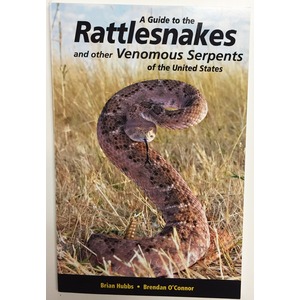 Curled rattlesnake in dry grass on a book cover reading “A Guide to the Rattlesnakes and other Venomous Serpents of the United States.”