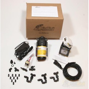 MistKing fogging system kit with pump tubing fittings cables and manual on a white surface