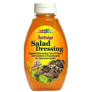 Orange bottle of Nature Zone Tortoise Salad Dressing with lettuce and turtle images on the label.