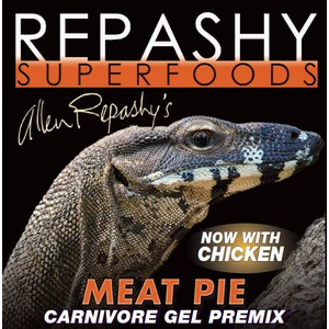 Close-up of a lizard against a dark background with bold branding and the text “Meat Pie Carnivore Gel Premix” and “Now with chicken.”