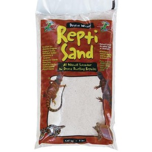 Bag of Repti-Sand desert white sand substrate for reptiles, with lizard illustrations on red packaging.