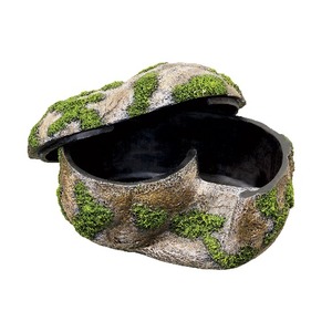 Moss-covered rock-shaped lidded box with a dark hollow interior, partially opened.