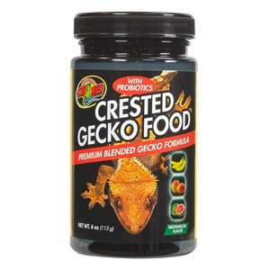 Bottle labeled Crested Gecko Food with probiotics; features a gecko image and watermelon flavor on the front.