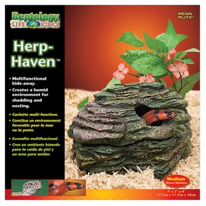 Herp-Haven reptile habitat packaging showing a rocky cave with a red snake peeking out, green leaves, and sandy bedding.