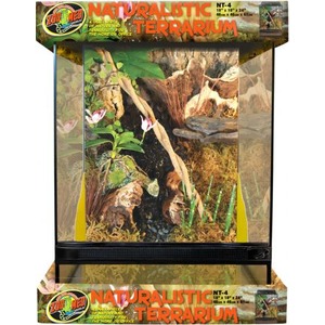 Glass terrarium with lush plants, rocks, and driftwood in a natural habitat setup.