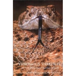 Close-up of a venomous rattlesnake with a forked tongue extended.