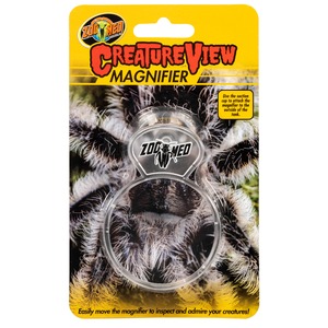 Bright yellow packaging for Creature View Magnifier by Zoo Med, with clear circular magnifier over a tarantula image.
