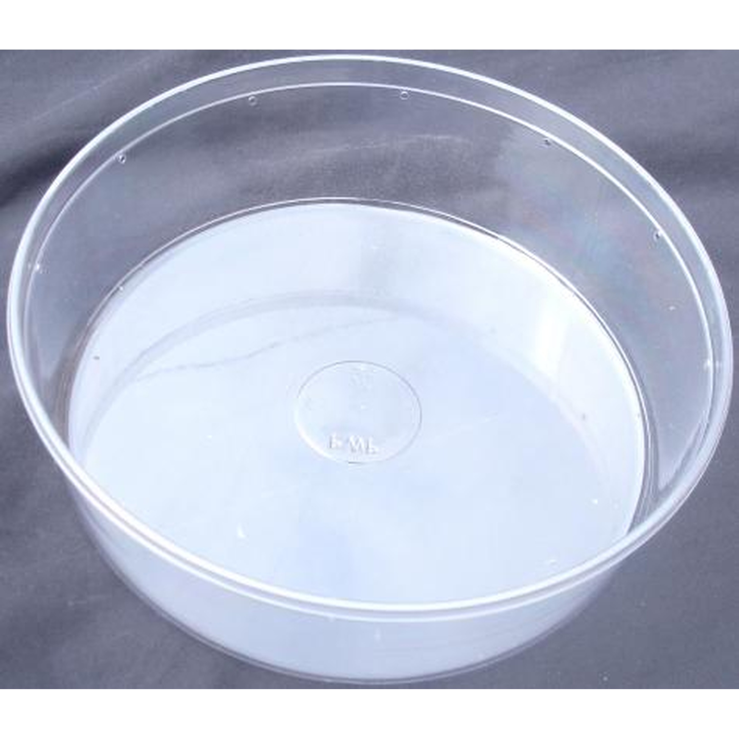 Clear plastic bowl with shallow water and a circular bottom mark, set on a dark surface.