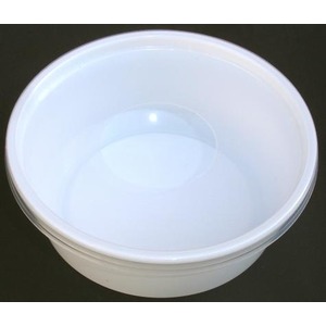 White plastic bowl with a smooth, rounded rim seen from above on a dark background.