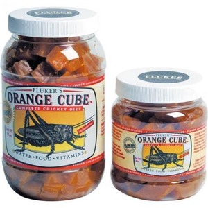 Two glass jars labeled Fluker's Orange Cube complete cricket diet, filled with orange-brown cube pieces.