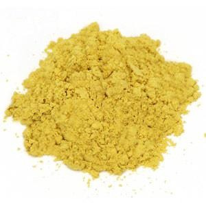 Yellow powder mound on white background