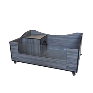 Gray wood-grain reception counter with curved back wall and wheeled base.