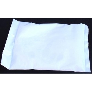 Crinkled white paper napkin on a dark background