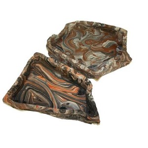 Brown and orange marbled scarf folded and draped with swirling patterns.