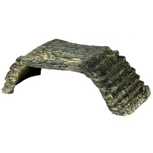 Rugged stone arch bridge fragment with a curved stair ramp on the right side.