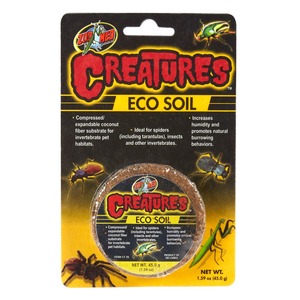 Zoo Med Creatures Eco Soil packaging with bold red “Creatures” logo and a round coconut-fiber substrate cake for invertebrate habitats.