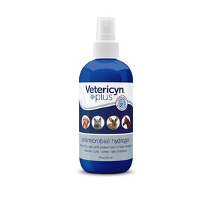 Blue spray bottle of Vetericyn Plus antimicrobial hydrogel with pet icons (dog, cat, rabbit, horse) on label.