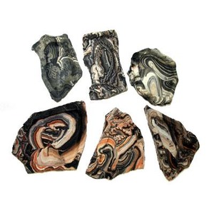 Six irregular, multicolored banded stones with swirled patterns.