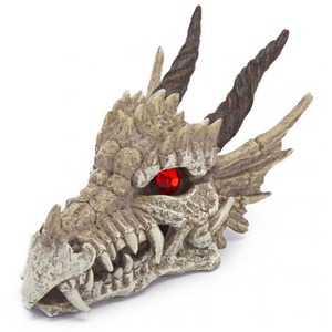 Weathered dragon skull with red eye and rugged horns facing left.