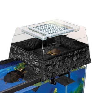 Aquarium setup with black textured base, clear lid, basking platform, and a turtle in the lower tank.