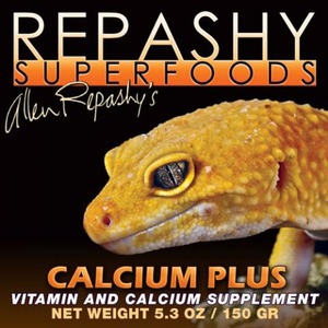 Close-up of a yellow gecko against a black background with "CALCIUM PLUS" and "REHASHY SUPERFOODS" branding.