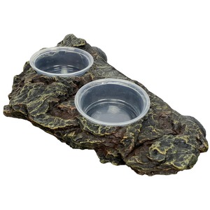 Rough, dark, lava-like rock with two clear plastic cups set into shallow indentations.