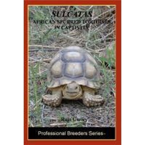 Sulcata African spurred tortoise on grass with plant background; Professional Breeders Series cover.