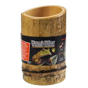 Wooden cylindrical humidifier with a black label showing a frog and text about humidity and incubation.