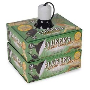 Fluker's clamp lamp on green packaging box with black clamp and gray top.