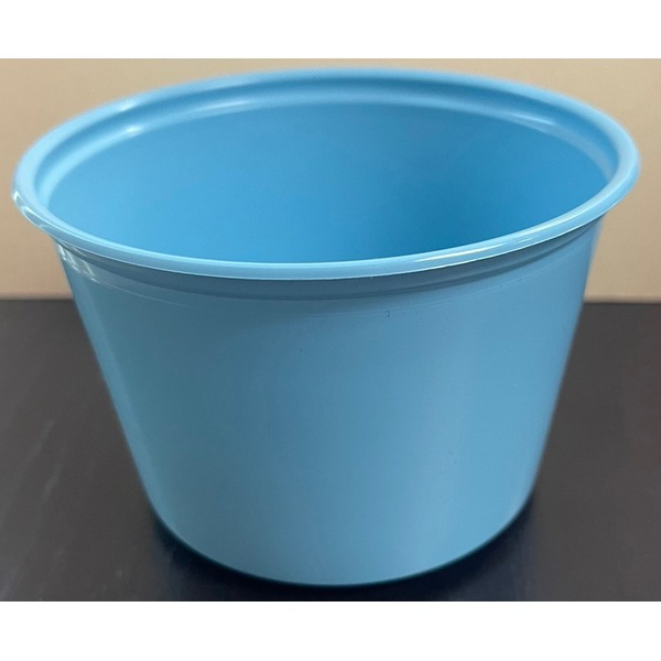 Blue plastic bucket with open top sits on a dark surface, viewed from above