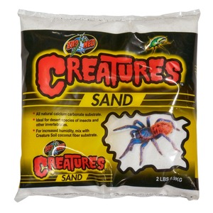 Zoo Med Creatures Sand bag with yellow-black design and a tarantula illustration.