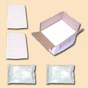 Two white folded sheets, two white pillow bags, and an open pink-interior cardboard box on a beige background.
