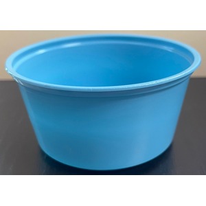 Blue plastic bucket on a dark surface, empty.