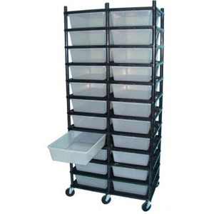 Tall wheeled rack with many clear plastic bins in rows, one bin extended from side.