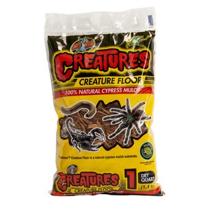 Bag of Zoo Med Creatures Creature Floor mulch with tarantula and centipede illustrations on a yellow label.