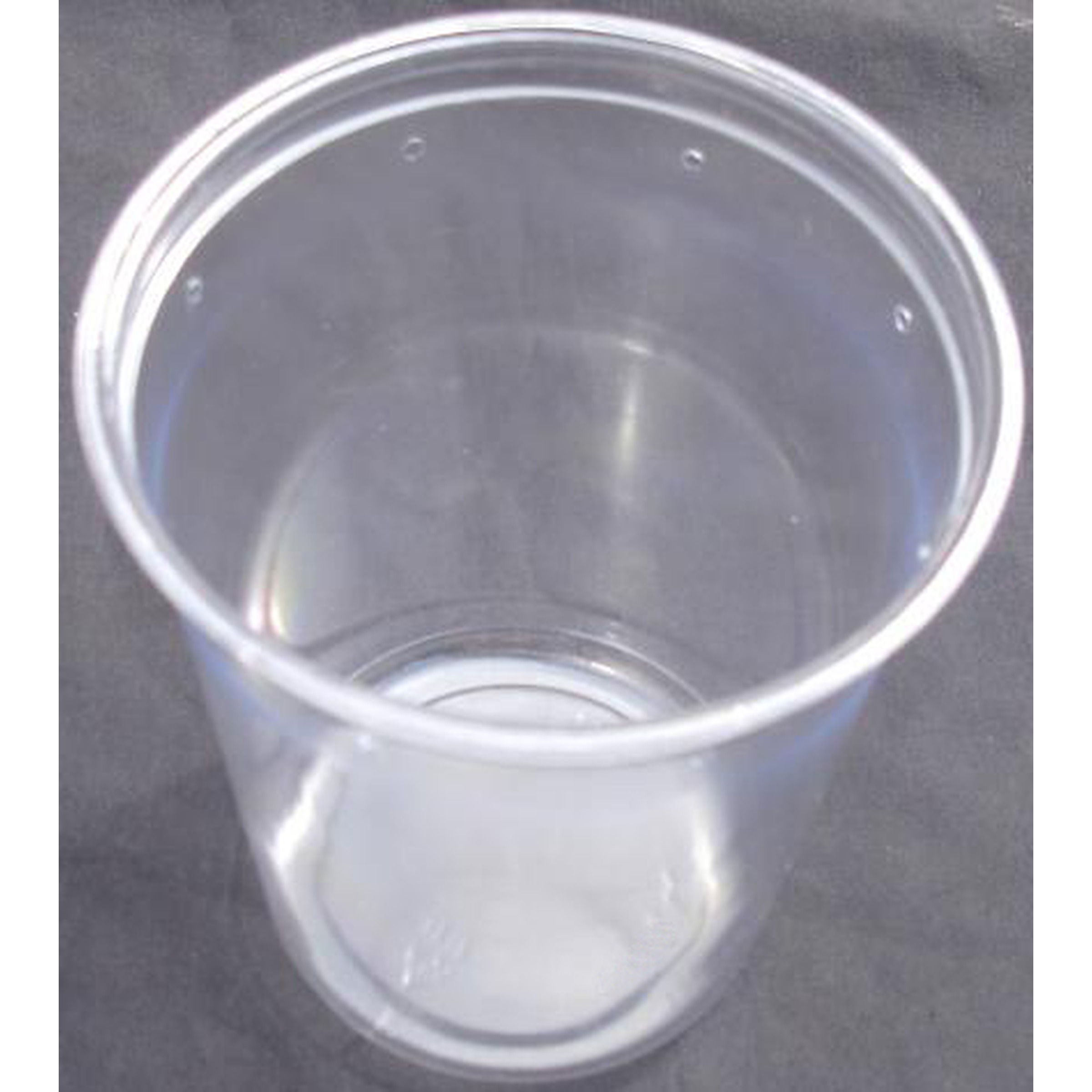Transparent plastic cup on a dark surface, empty, with light reflections.